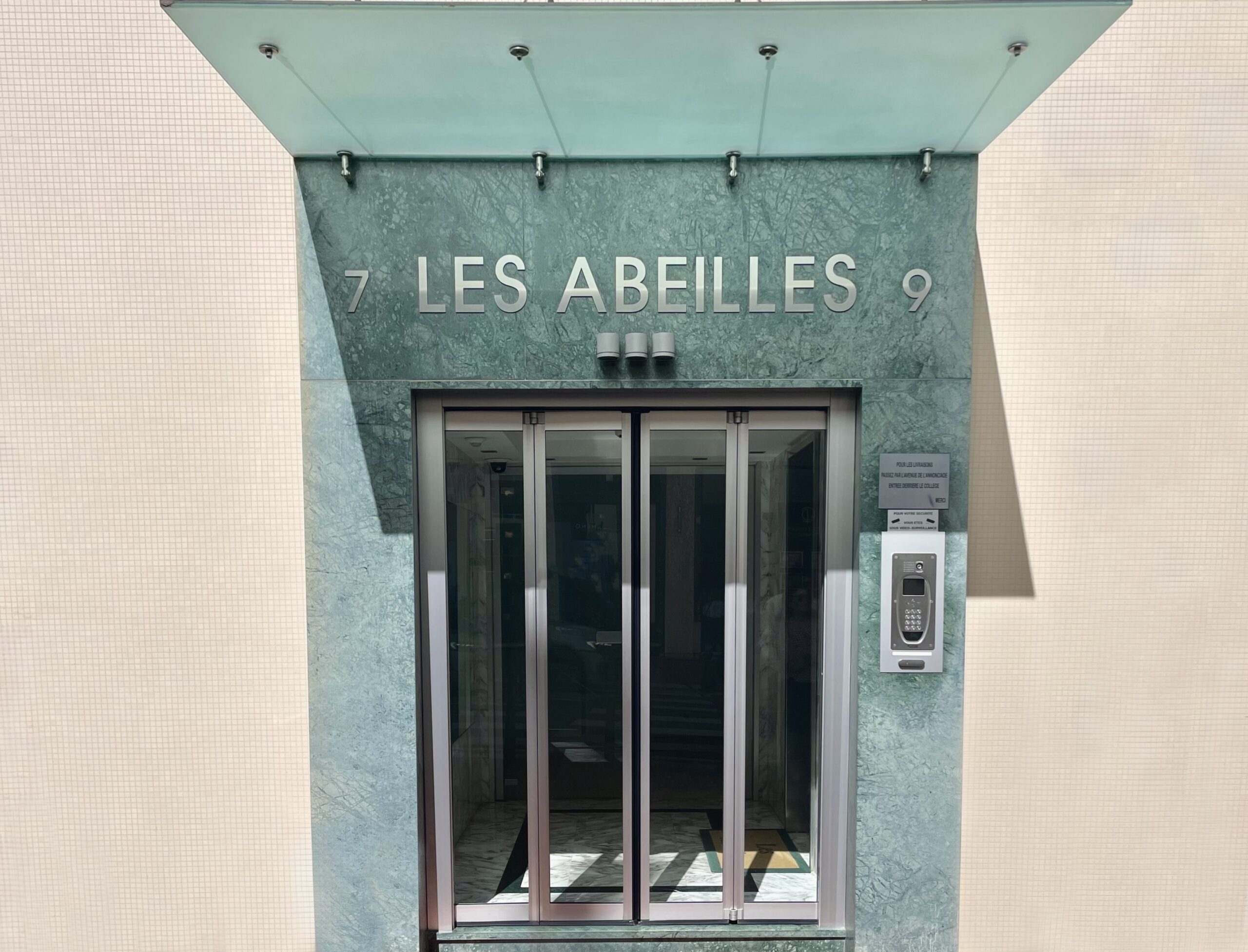 Entrance of Les Abeilles residential building in Monaco