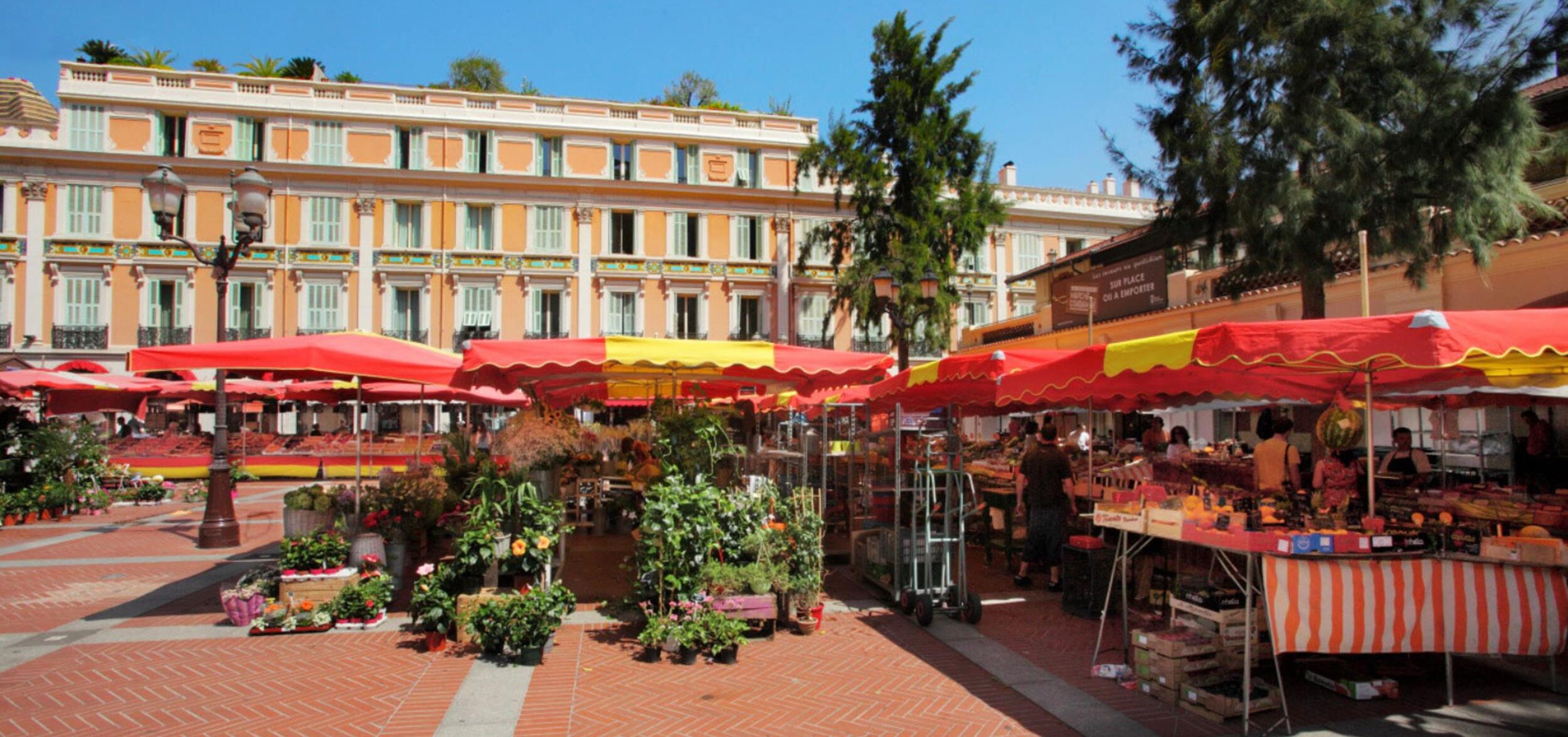 Fresh produce and flower stalls at the Place d’Armes market Monaco