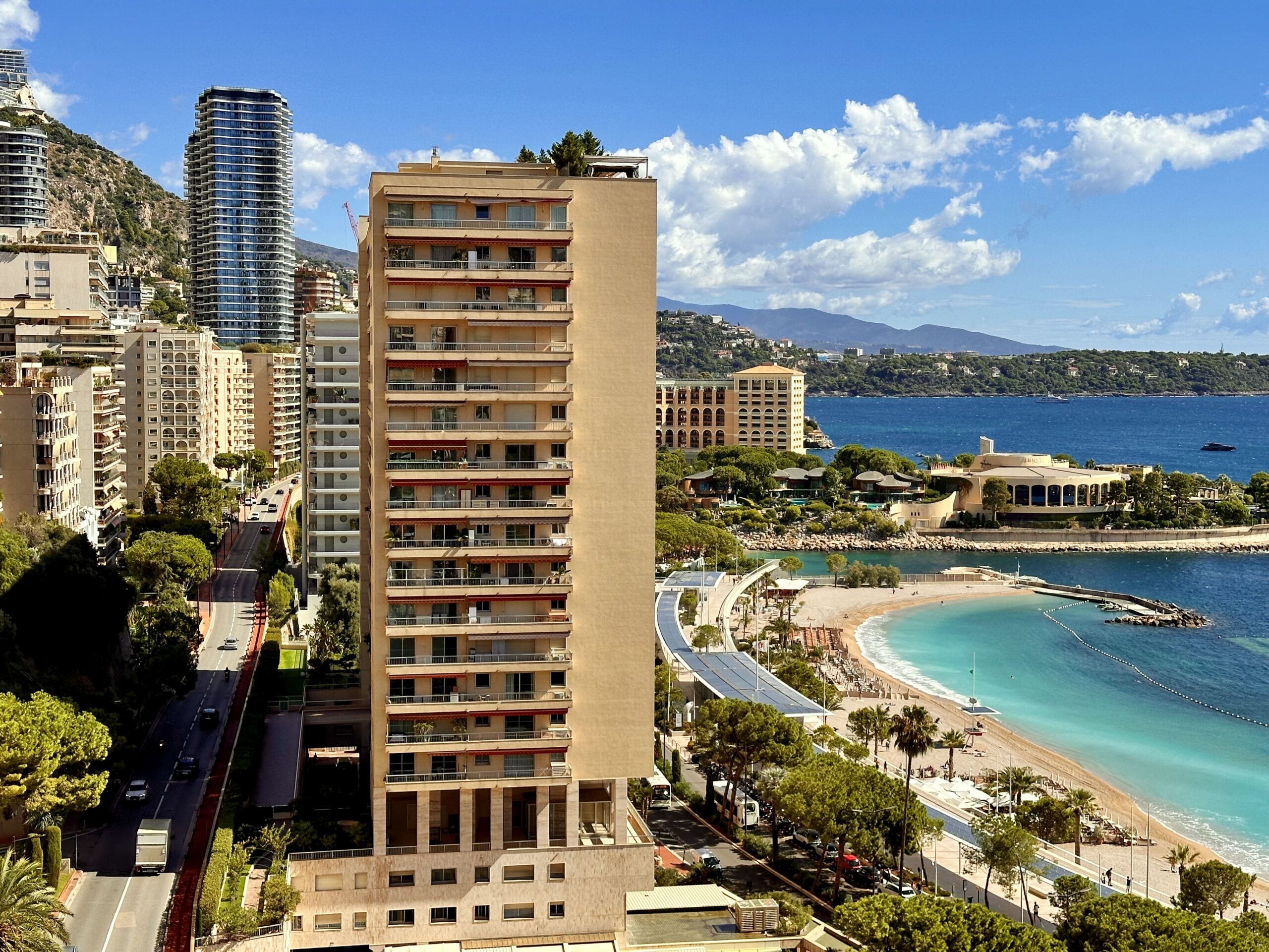 Larvotto Beach and Monaco seafront with residential buildings