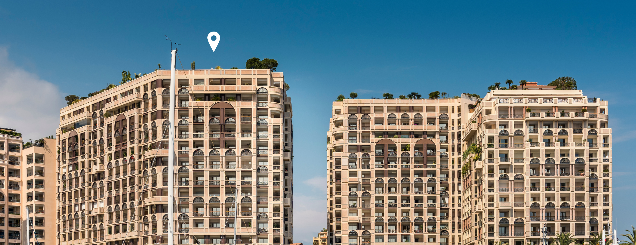 Seaside Plaza building in Fontvieille, marked with a white location pin
