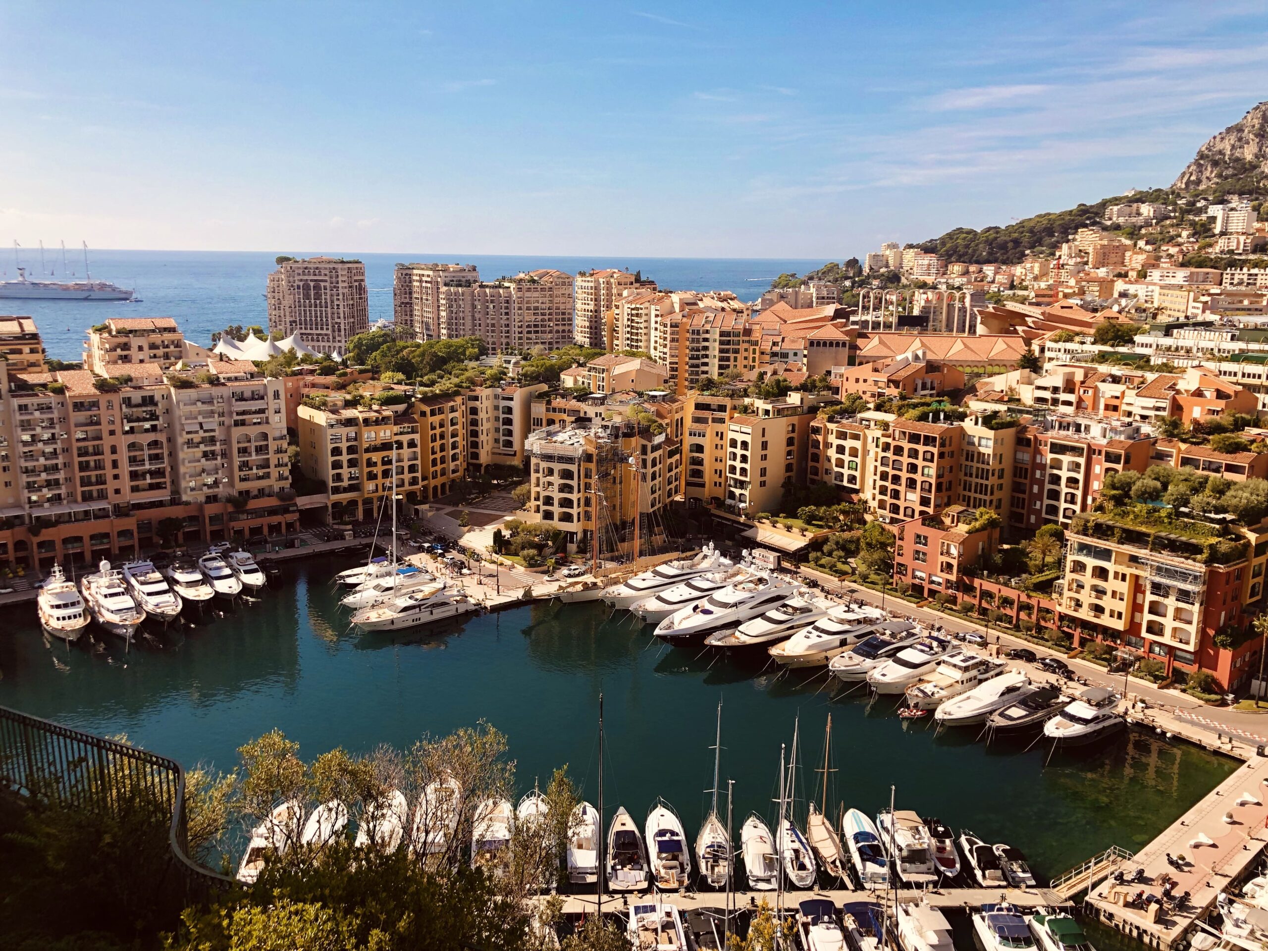 Port de Fontvieille marina with yachts and residential buildings in Monaco