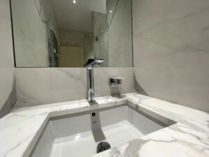 bathroom with a marble sink