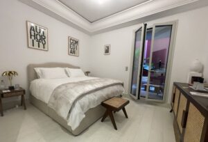 Bedroom and the door leading to the balcony