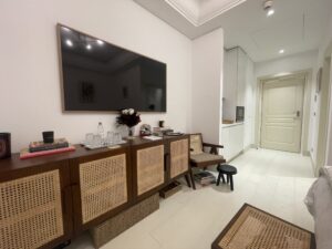 Bedroom in Villa Palazzino with tv and brown, modern interiors